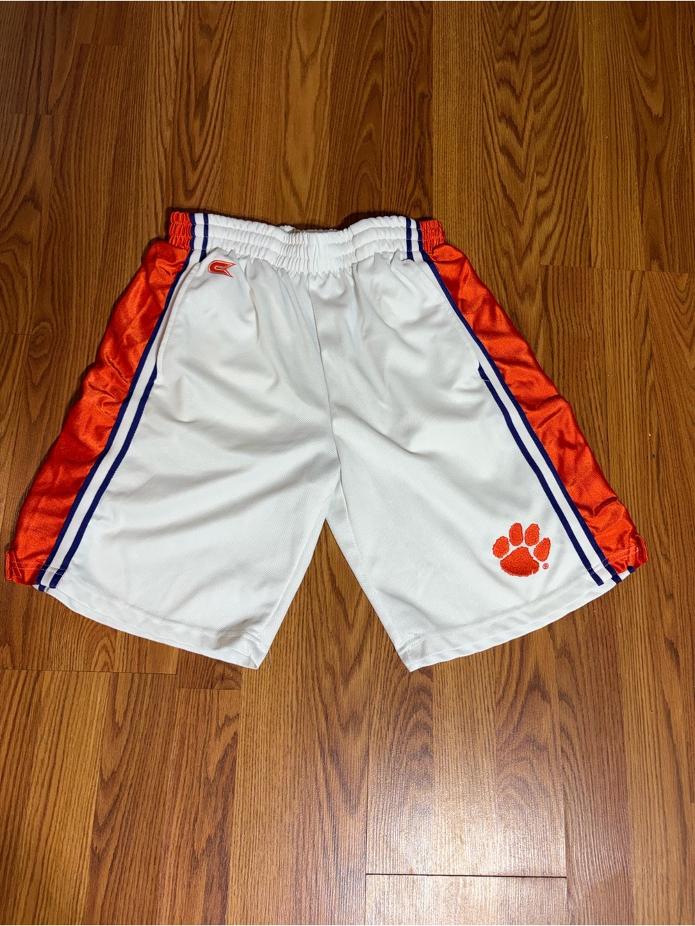 Colosseum White and Orange Athletic Shorts with Blue Trim. Clemson